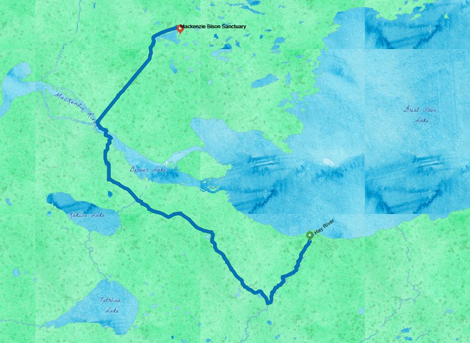 A watercolor map shows Great Slave Lake in Blue on the upper right, with a blue route line from Hay River, on the shore, northwest to cross the Mackenzie River, and then across to the Bison Sanctuary. 