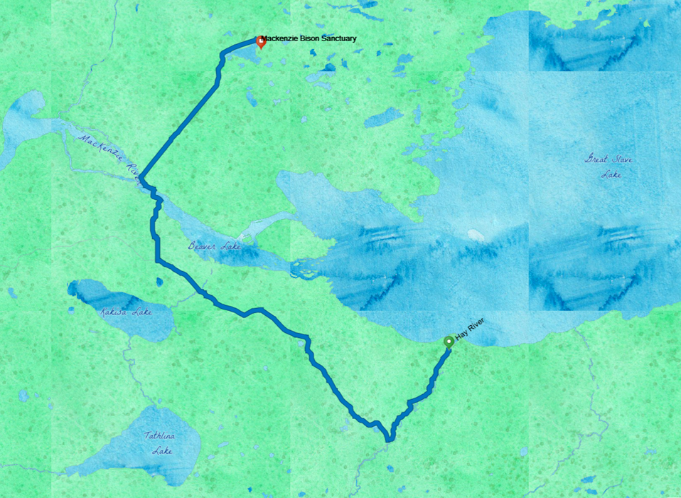 A watercolor map shows Great Slave Lake in Blue on the upper right, with a blue route line from Hay River, on the shore, northwest to cross the Mackenzie River, and then across to the Bison Sanctuary. 