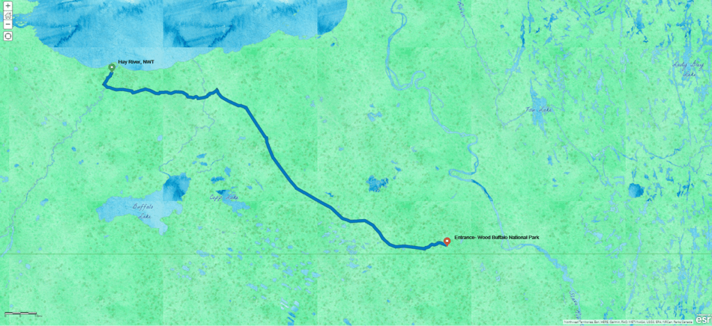 Watercolor basemap, bright green and blue for water, showing a route from Hay River, NWT, to the Entrance of Wood Buffalo National Park, just north of the Alberta border. 